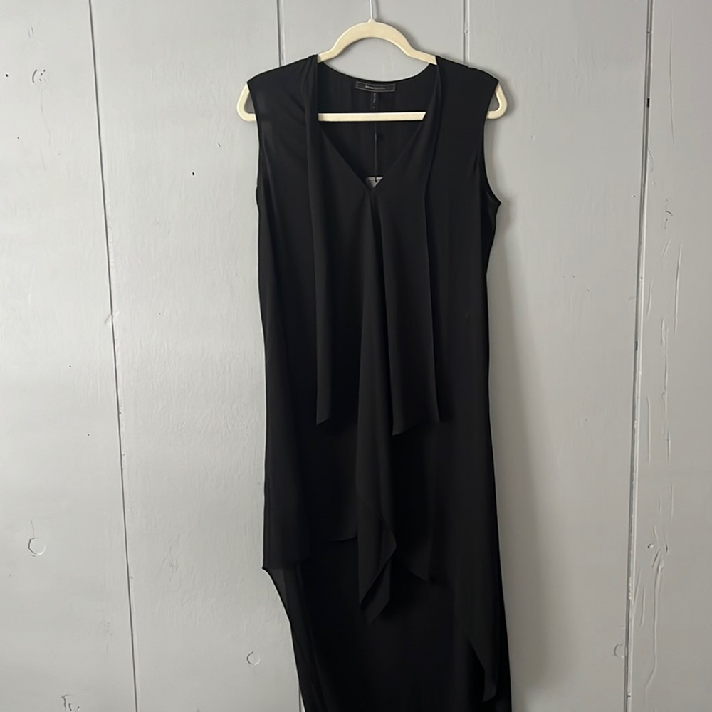 Small BCBG summer black dress. Flows beautifully with longer back than front.